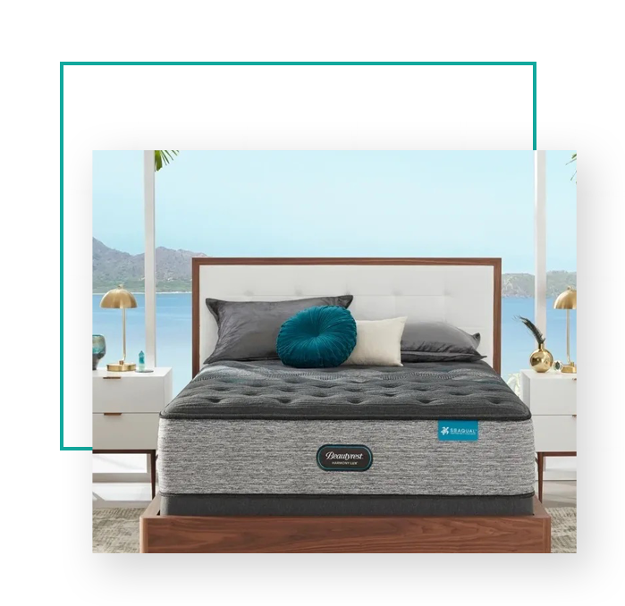 The bed is adorned with a modern classic black mattress, while the furniture showcases a stylish grey tone.