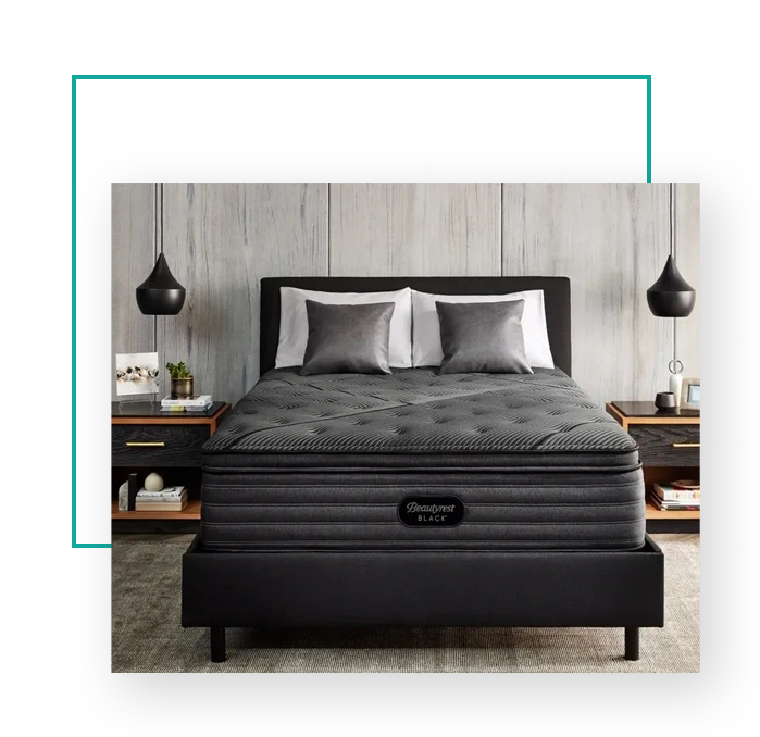 The black mattress complements the black bed, creating a sleek and stylish aesthetic.